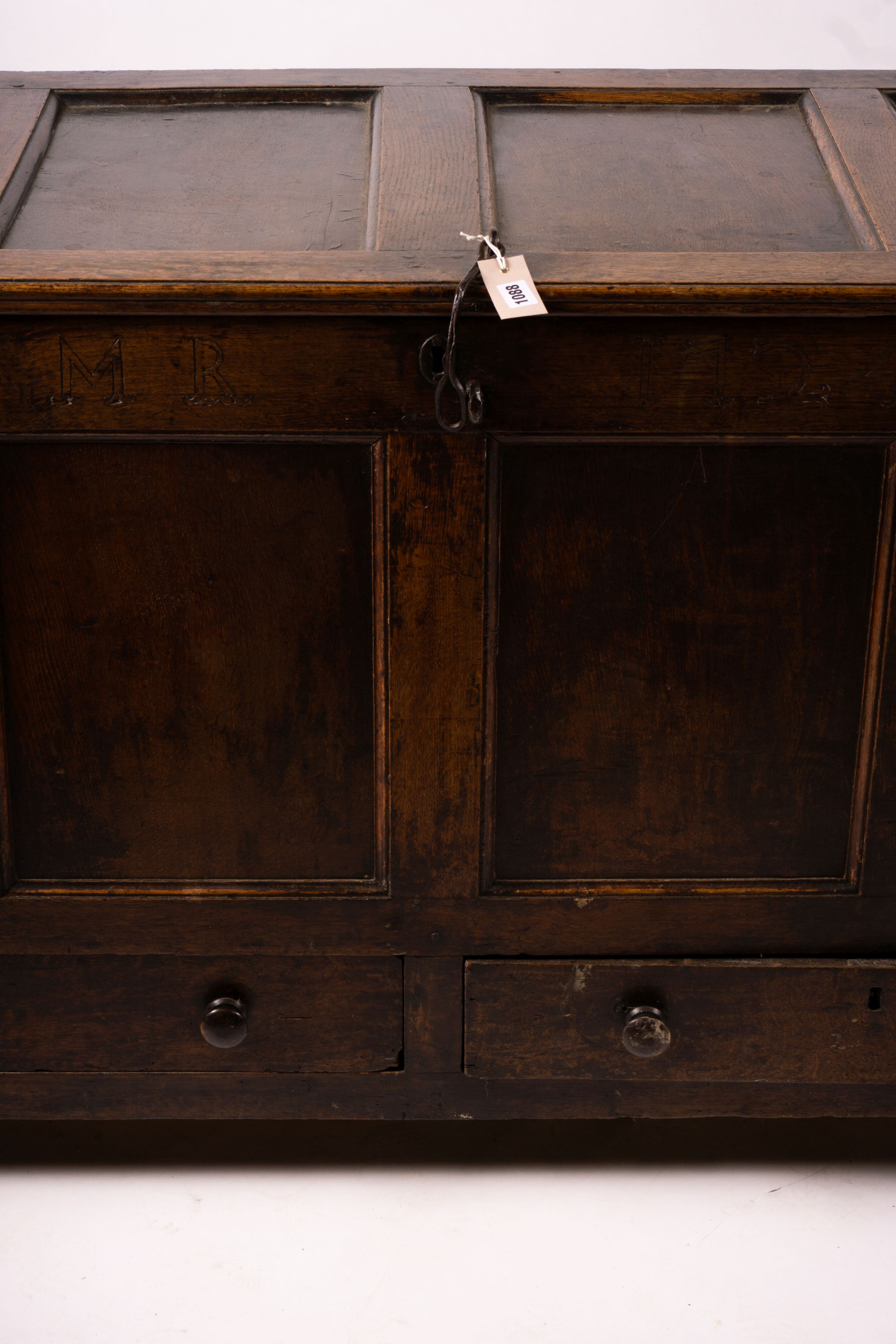 An 18th century panelled oak mule chest, length 161cm, depth 61cm, height 84cm